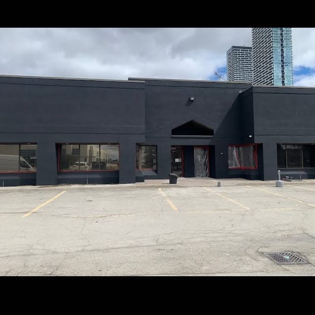 Ozwan Stucco applying EIFS base coat and waterproofing in Toronto