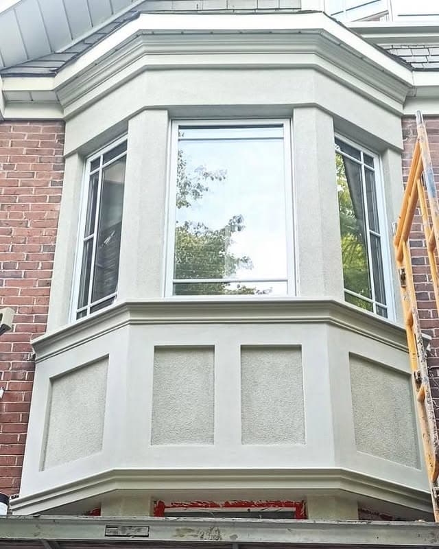Foundation parging repair with mesh-reinforced base coat by Ozwan Stucco in Toronto